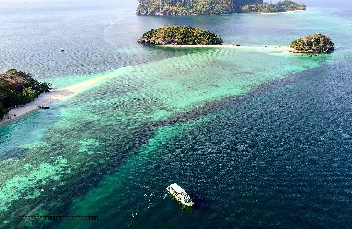 Speedboat and longtail boat on turquoise water near Krabi islands Thailand