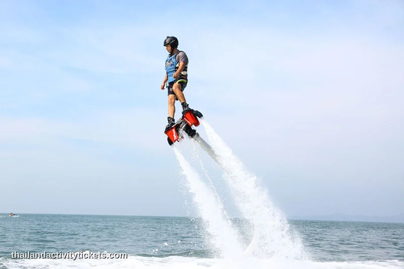 First-time flyer learning balance on a Flyboard with a certified instructor in Pattaya