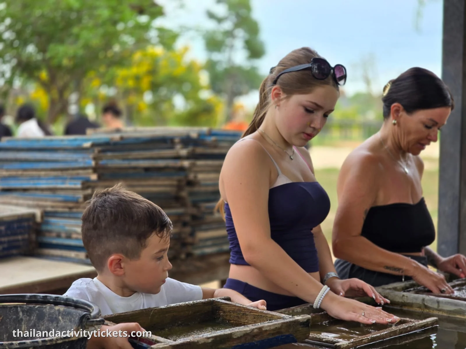 Tourists feeding elephants at Elephant Sanctuary Pattaya