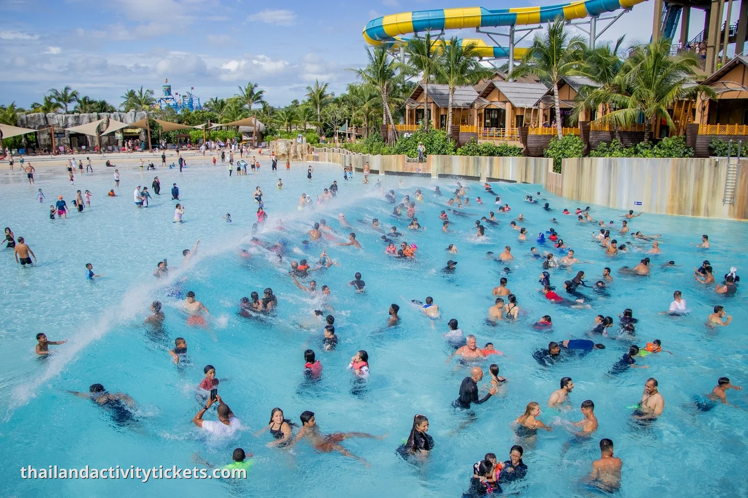 Surf enthusiasts practicing on the FlowRider machine at the Emerald Forest zone in Andamanda