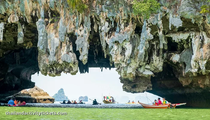 Sea canoe kayaking through limestone caves Phang Nga Bay tour
