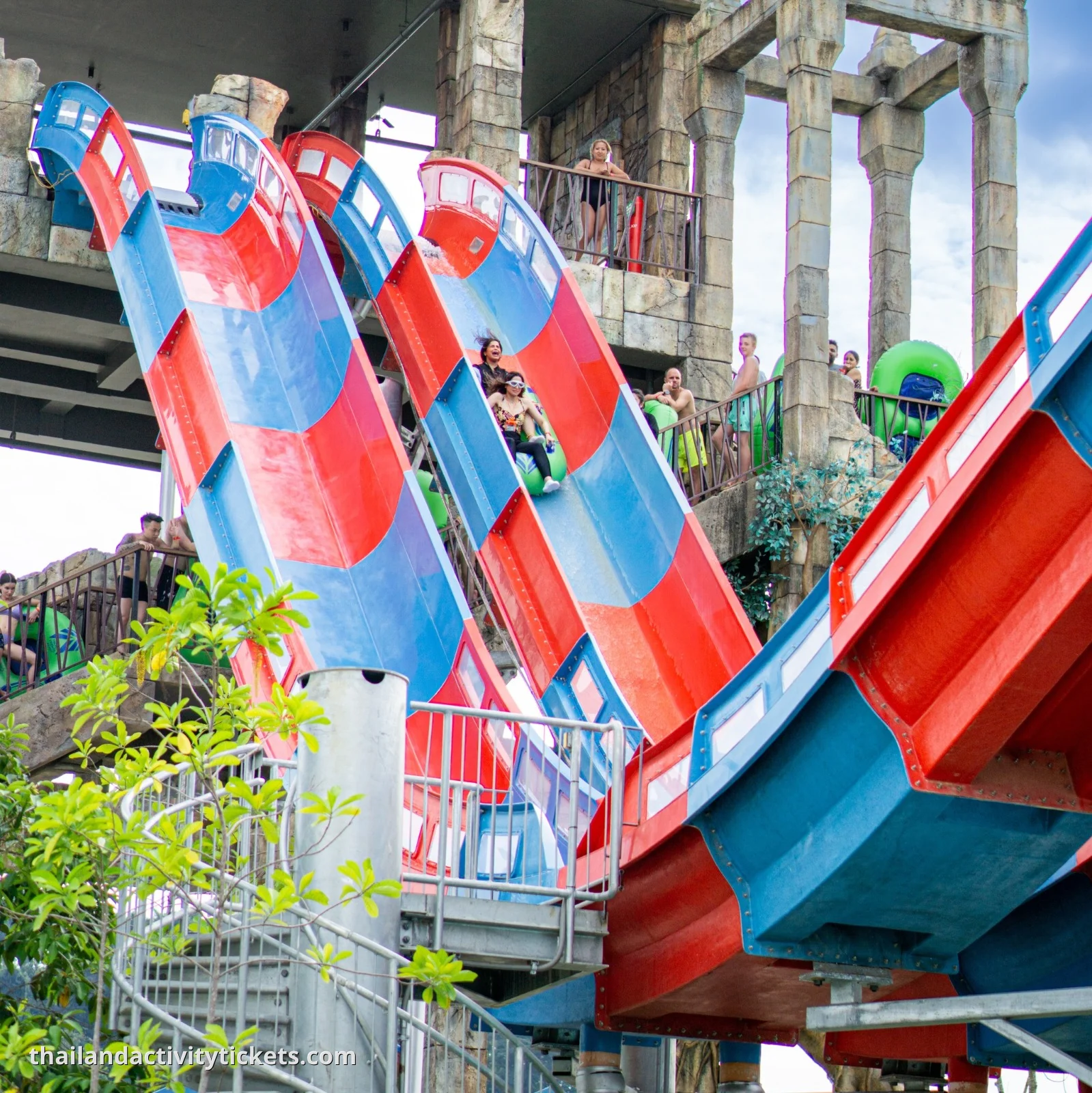 Thrill-seekers entering the 'Dragon's Drop' vertical plummet capsule for a free-fall experience