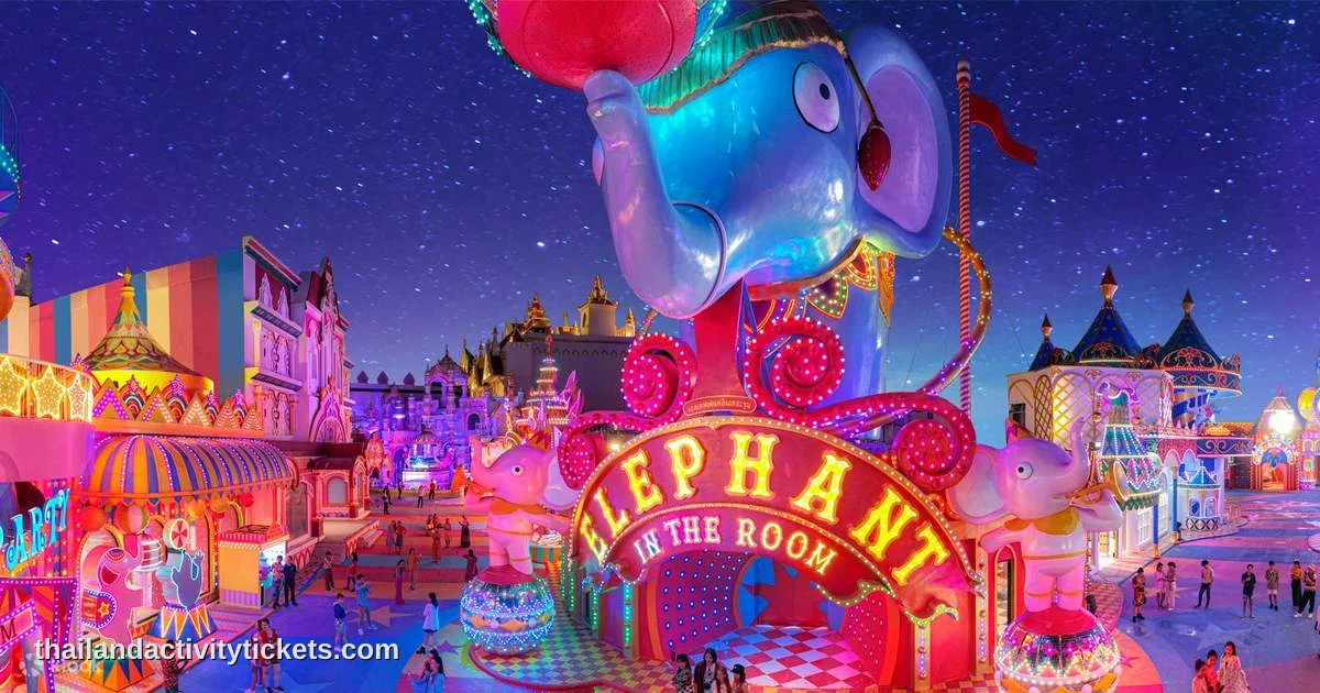 A vibrant nighttime view of the glowing neon castle structures and festival streets inside the Carnival Fun Fair zone at Carn