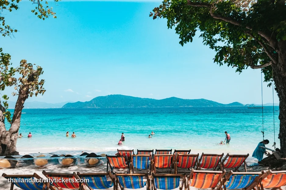 Couple relaxing at Coral Island Phuket beach