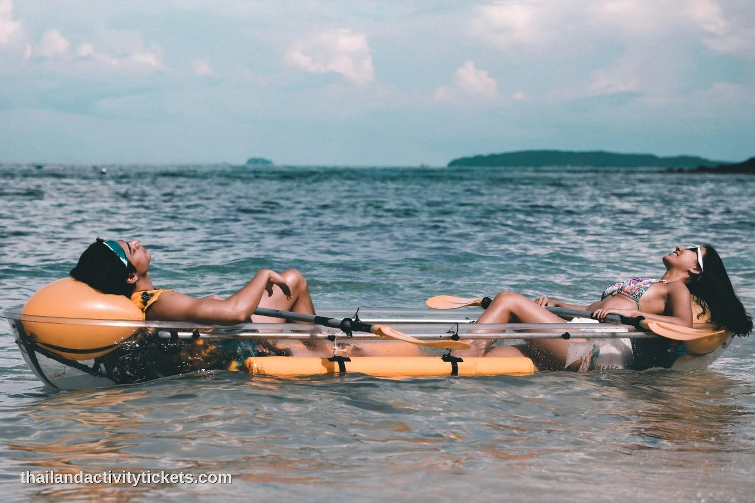 Couple relaxing at Banana Beach Koh Hey Phuket