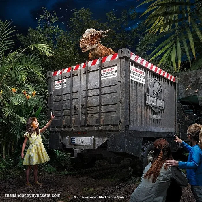 Visitors taking photos with dinosaurs at Jurassic World Bangkok