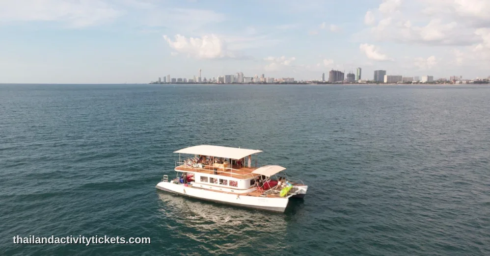 Live Punjabi Dhol drummer playing traditional beats on a boat party cruise in Pattaya