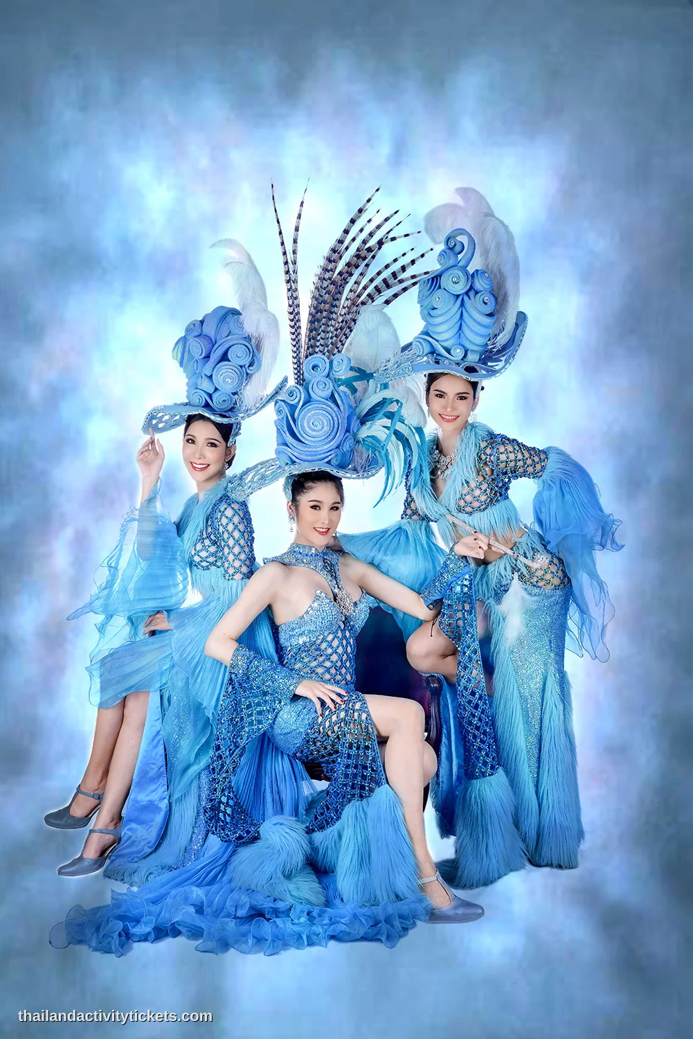 Tourists taking photos with cabaret performers in Chiang Mai