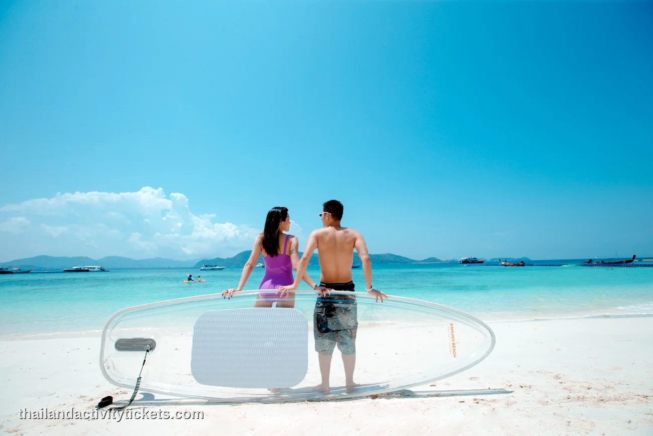 Couple relaxing at Racha Island beach