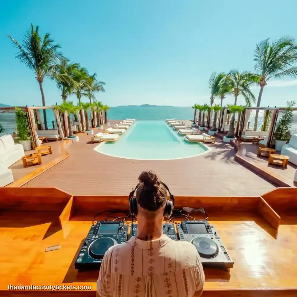 International guest DJ performing during the sunset party session at Sina Beach Club