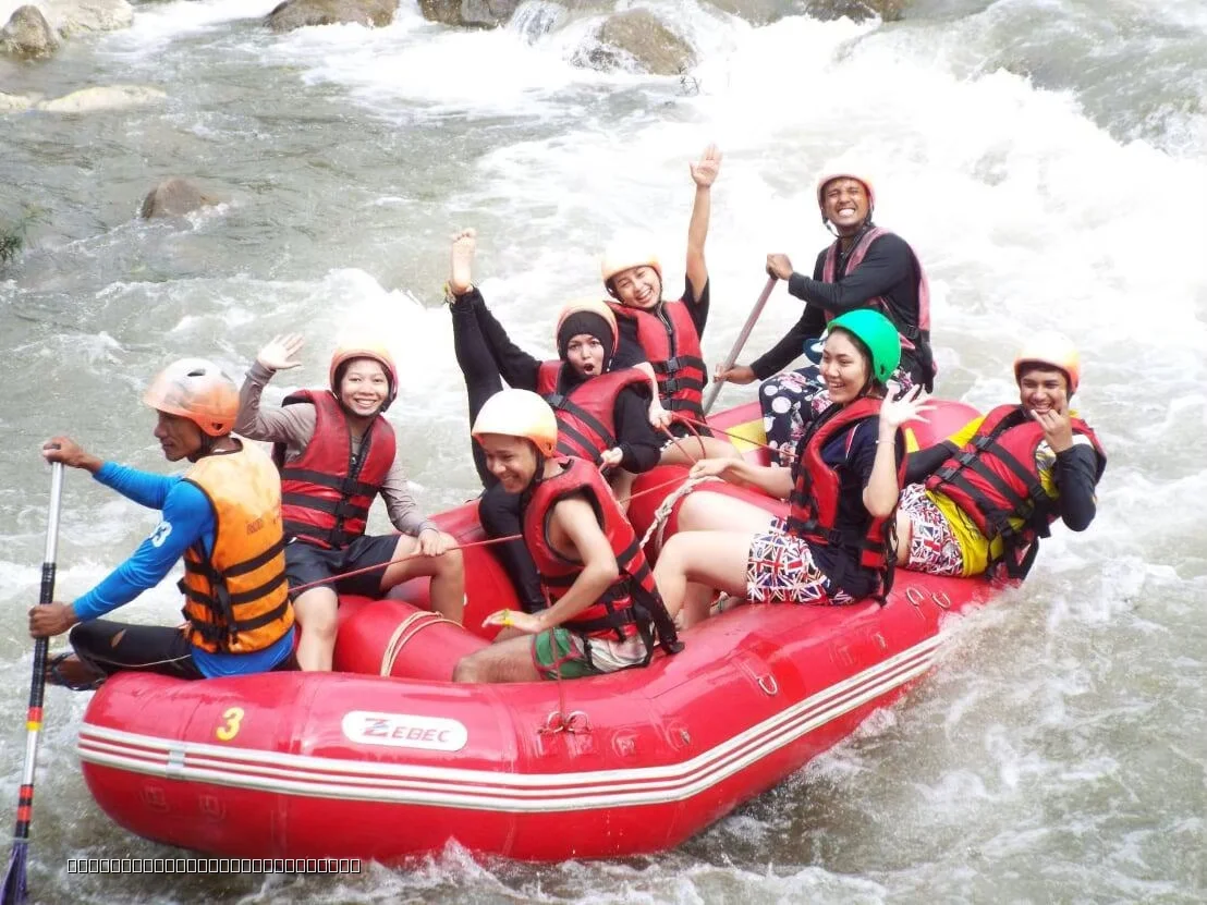 Group of tourists enjoying 5km white water rafting on the Song Phraek River in Phang Nga, Phuket.