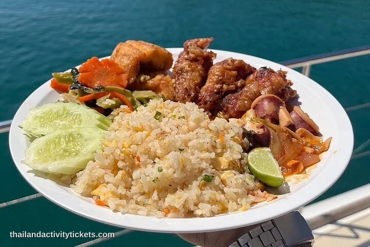 Freshly prepared Thai buffet lunch served onboard a luxury yacht cruise in Pattaya